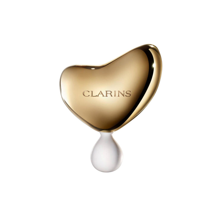 Piatră de masaj facial Clarins Precious, aurie